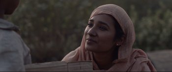 Movie still from “Lion” (2016), directed by Garth Davis – A person wearing a headscarf; Close Up shot, Low angle