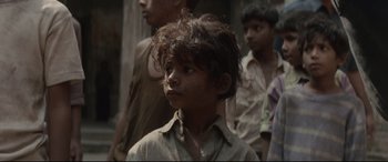 Movie still from “Lion” (2016), directed by Garth Davis – A group of young boys standing next to each other; Close Up shot, Low angle
