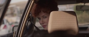Movie still from “Lion” (2016), directed by Garth Davis – A person sitting in a car looking out of the window; Close Up shot, Over the shoulder angle