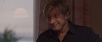 Movie still from “Lion” (2016), directed by Garth Davis – A person wearing a black shirt; Close Up shot, Over the shoulder angle