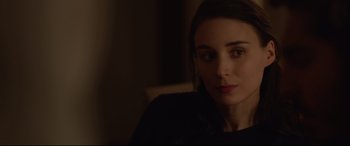 Movie still from “Lion” (2016), directed by Garth Davis – A person sitting in a chair; Close Up shot, Over the shoulder angle