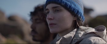Movie still from “Lion” (2016), directed by Garth Davis – A person wearing a hat; Close Up shot, Over the shoulder angle