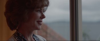 Movie still from “Lion” (2016), directed by Garth Davis – A woman's face looking out a window; Close Up shot, Over the shoulder angle