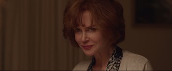 Movie still from “Lion” (2016), directed by Garth Davis – A person with red hair; Close Up shot, Over the shoulder angle