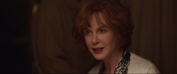 Movie still from “Lion” (2016), directed by Garth Davis – A person with red hair; Close Up shot, Over the shoulder angle