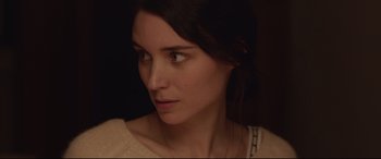 Movie still from “Lion” (2016), directed by Garth Davis – A woman's face in the dark; Close Up shot, Over the shoulder angle