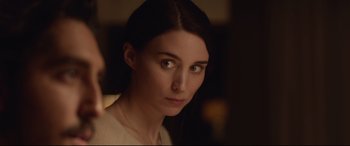 Movie still from “Lion” (2016), directed by Garth Davis – A person wearing a sweater; Close Up shot, Over the shoulder angle