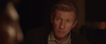 Movie still from “Lion” (2016), directed by Garth Davis – A person wearing a jacket; Close Up shot, Over the shoulder angle