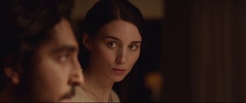 Movie still from “Lion” (2016), directed by Garth Davis – A person looking at the camera; Close Up shot, Over the shoulder angle