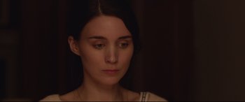 Movie still from “Lion” (2016), directed by Garth Davis – A person looking down at the ground; Close Up shot, Over the shoulder angle