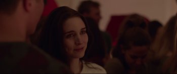 Movie still from “Lion” (2016), directed by Garth Davis – A person sitting in front of a group of people; Close Up shot, Over the shoulder angle