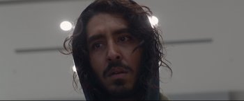 Movie still from “Lion” (2016), directed by Garth Davis – A person with long hair; Close Up shot, Low angle