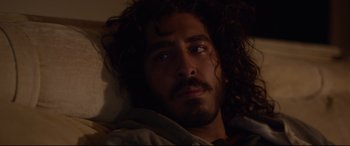 Movie still from “Lion” (2016), directed by Garth Davis – A person laying in a bed; Close Up shot, Over the shoulder angle