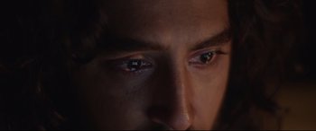 Movie still from “Lion” (2016), directed by Garth Davis – A man's eyes in the dark; Extreme Close Up shot, Overhead angle