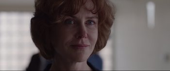 Movie still from “Lion” (2016), directed by Garth Davis – A woman's face with blue eyes; Close Up shot, Over the shoulder angle