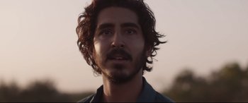 Movie still from “Lion” (2016), directed by Garth Davis – A person with a beard; Close Up shot, Low angle