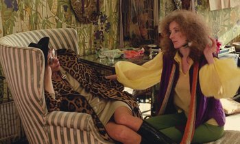 Movie still from “Lions Love (... and Lies)” (1969), directed by Agnès Varda – Two women sitting on a chair in front of a mirror; Medium shot, Over the shoulder angle