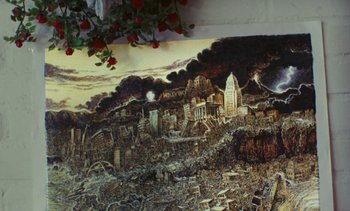 Movie still from “Lions Love (... and Lies)” (1969), directed by Agnès Varda – A painting of a city with a lot of destruction; Extreme Close Up shot, Overhead angle