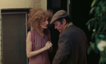 Movie still from “Lions Love (... and Lies)” (1969), directed by Agnès Varda – A man and a woman standing next to each other; Medium shot, Over the shoulder angle