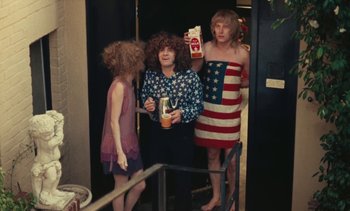 Movie still from “Lions Love (... and Lies)” (1969), directed by Agnès Varda – A group of people standing next to each other in a room; Medium shot, High angle