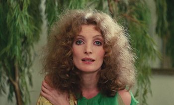 Movie still from “Lions Love (... and Lies)” (1969), directed by Agnès Varda – A person wearing a green shirt; Close Up shot, High angle