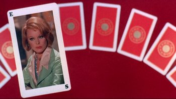 Movie still from “Lisa and the Devil” (1973), directed by Mario Bava – A playing card with a picture of a woman on it; Close Up shot, Overhead angle