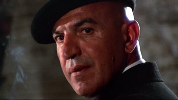 Movie still from “Lisa and the Devil” (1973), directed by Mario Bava – A person wearing a hat; Close Up shot, Low angle