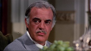 Movie still from “Lisa and the Devil” (1973), directed by Mario Bava – A man that is looking at the camera; Close Up shot, Low angle