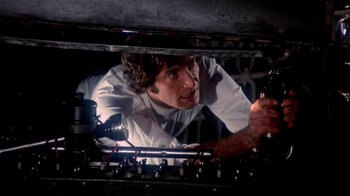 Movie still from “Lisa and the Devil” (1973), directed by Mario Bava – A man is looking through the window of an oven; Close Up shot, Low angle