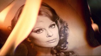 Movie still from “Lisa and the Devil” (1973), directed by Mario Bava – A woman's face in black - and - white photo; Extreme Close Up shot, Low angle