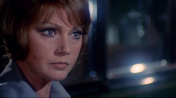 Movie still from “Lisa and the Devil” (1973), directed by Mario Bava – A person with blue eyes; Close Up shot, Over the shoulder angle