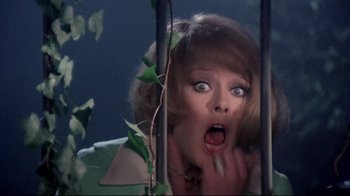 Movie still from “Lisa and the Devil” (1973), directed by Mario Bava – A woman with her mouth wide open looking at the camera; Close Up shot, Low angle