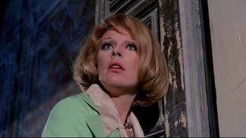 Movie still from “Lisa and the Devil” (1973), directed by Mario Bava – A person wearing a green shirt; Close Up shot, Low angle