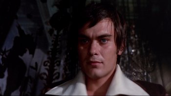 Movie still from “Lisa and the Devil” (1973), directed by Mario Bava – A person wearing a white shirt; Close Up shot, Low angle