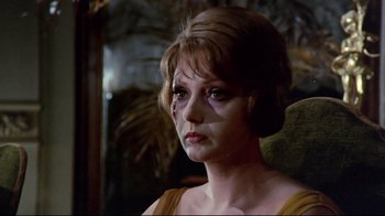 Movie still from “Lisa and the Devil” (1973), directed by Mario Bava – A person wearing a yellow shirt; Close Up shot, Low angle