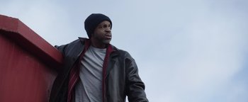 Movie still from “Wish Upon” (2017), directed by John R. Leonetti – A man wearing a hat and a leather jacket; Close Up shot, Low angle