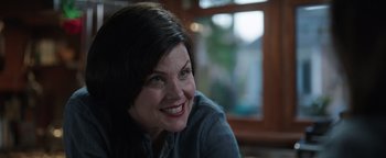 Movie still from “Wish Upon” (2017), directed by John R. Leonetti – A person sitting in front of a window; Close Up shot, Over the shoulder angle