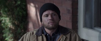 Movie still from “Wish Upon” (2017), directed by John R. Leonetti – A person wearing a jacket and a hat; Close Up shot, High angle