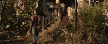 Movie still from “Wish Upon” (2017), directed by John R. Leonetti – A woman walking down the steps of a house; Wide shot, Over the shoulder angle