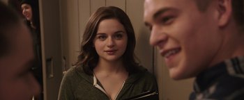Movie still from “Wish Upon” (2017), directed by John R. Leonetti – A young woman looking at a man in the mirror; Close Up shot, Over the shoulder angle