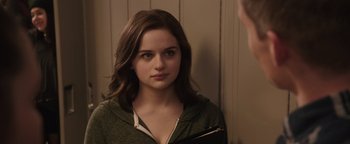 Movie still from “Wish Upon” (2017), directed by John R. Leonetti – A young woman looking into a mirror while holding a purse; Close Up shot, Over the shoulder angle