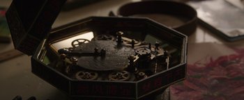 Movie still from “Wish Upon” (2017), directed by John R. Leonetti – An old clock with chinese characters on it; Extreme Close Up shot, Overhead angle