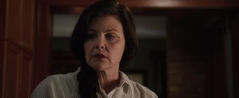 Movie still from “Wish Upon” (2017), directed by John R. Leonetti – An older woman is looking at the camera; Close Up shot, Low angle