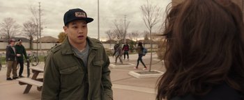 Movie still from “Wish Upon” (2017), directed by John R. Leonetti – A man in a green jacket and a woman in a green jacket; Close Up shot, Over the shoulder angle