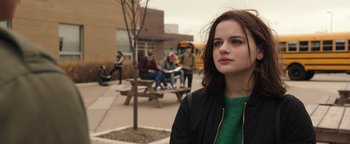 Movie still from “Wish Upon” (2017), directed by John R. Leonetti – A woman standing in front of a group of people; Close Up shot, Over the shoulder angle