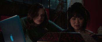 Movie still from “Wish Upon” (2017), directed by John R. Leonetti – A woman sitting in front of an open box; Close Up shot, Over the shoulder angle