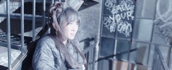 Movie still from “Wish Upon” (2017), directed by John R. Leonetti – A woman in a fur coat and a long veil; Close Up shot, High angle