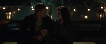 Movie still from “Wish Upon” (2017), directed by John R. Leonetti – A man and a woman sitting next to each other; Medium shot, Over the shoulder angle