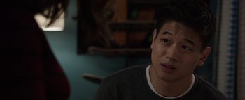 Movie still from “Wish Upon” (2017), directed by John R. Leonetti – A young man sitting in front of a mirror; Close Up shot, Over the shoulder angle