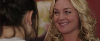 Movie still from “Wish Upon” (2017), directed by John R. Leonetti – A person with long blonde hair; Close Up shot, Over the shoulder angle